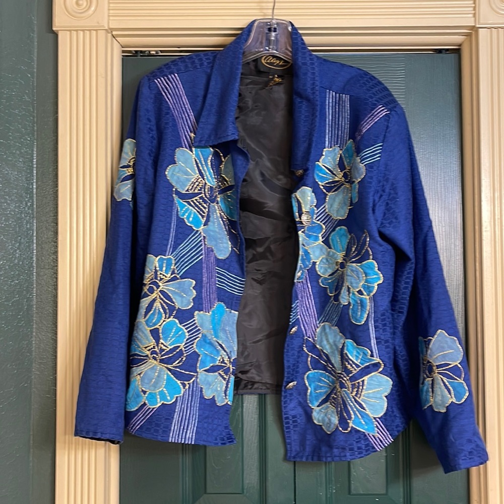 Alex Kim, blue textured jacket, aqua flowers with gold glitter trim.